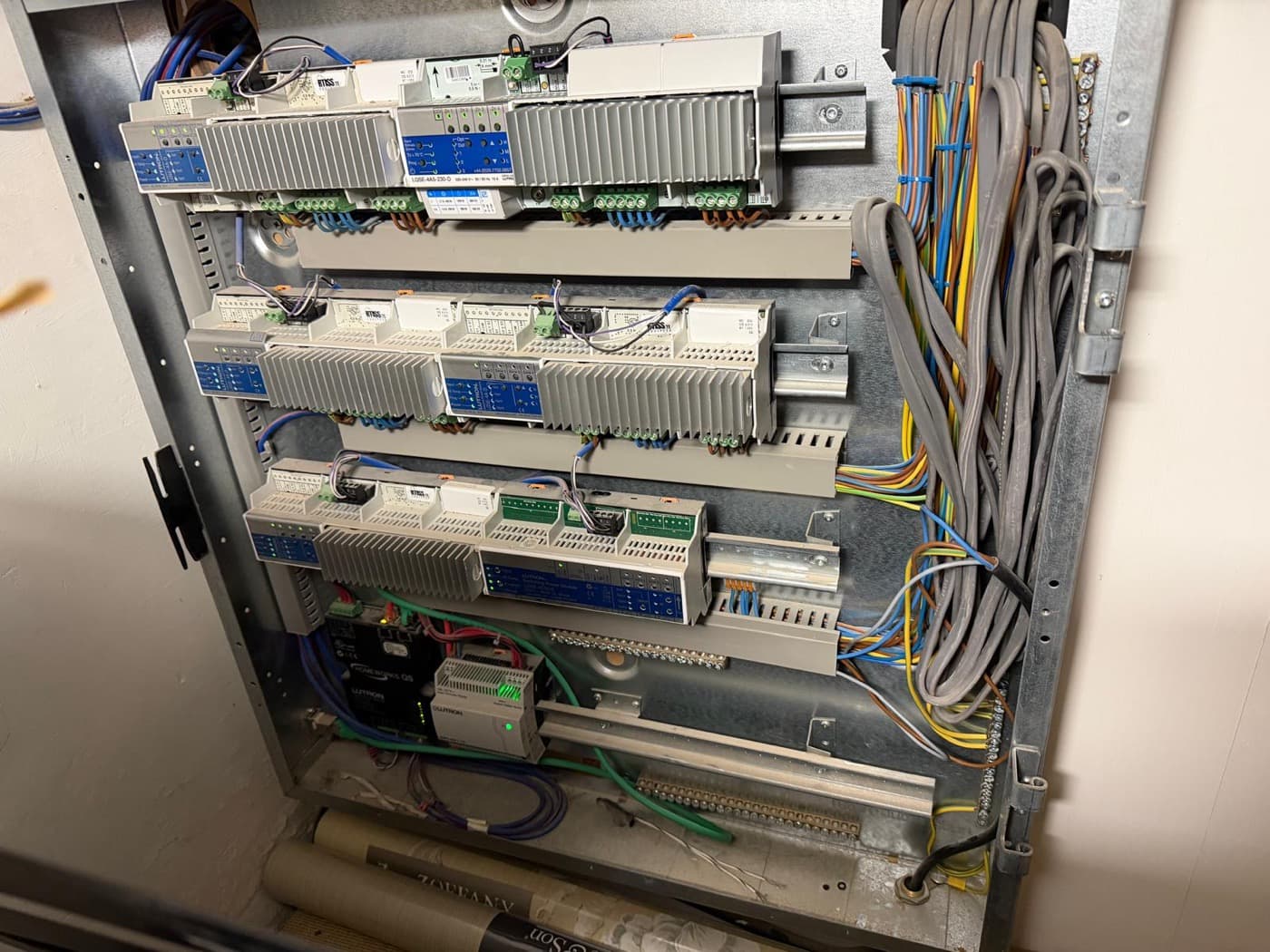 Commercial control panel with DIN-rail modules and neatly loomed wiring